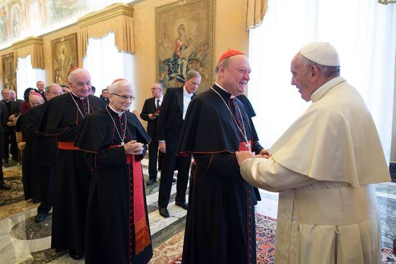 Pope Francis greets participants in the plenary assembly of the Congregation for the Doctrine of the Faith at the Vatican's Clementine Hall