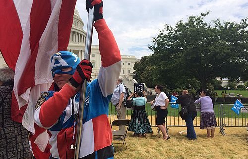 A man dressed as Captain America and holding an American flag takes part in the March for Marriage in Washington