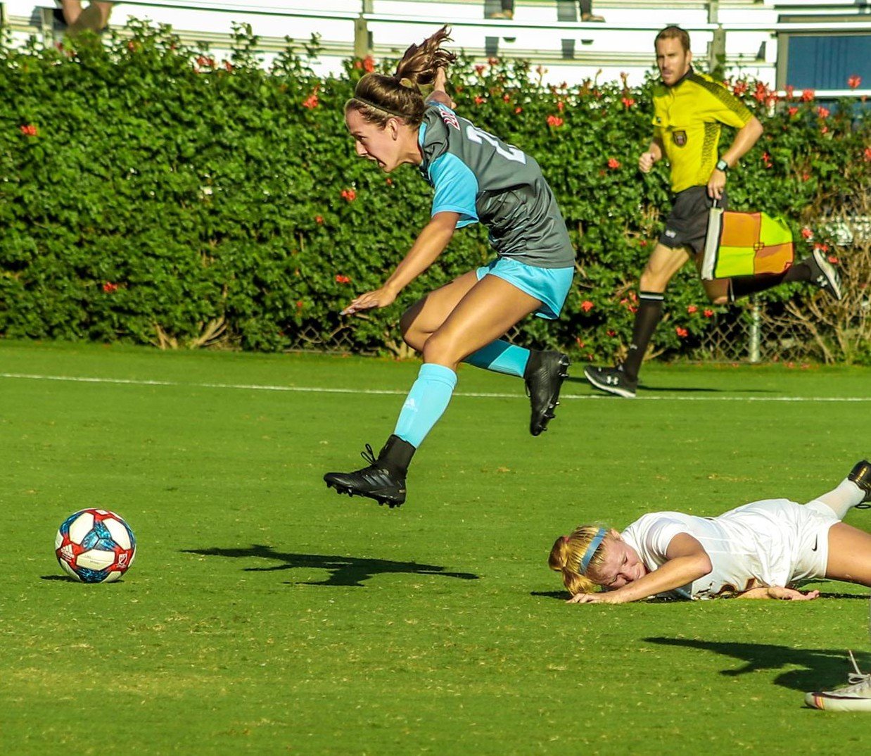 Madison Werner hurdles a Drexel defender and hurries after the ball in LMU’s 1-1 tie Sept. 6