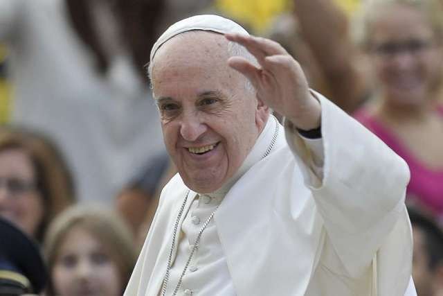 Pope Francis waves to pilgrims at the general audience in St. Peter's Square on Oct. 7