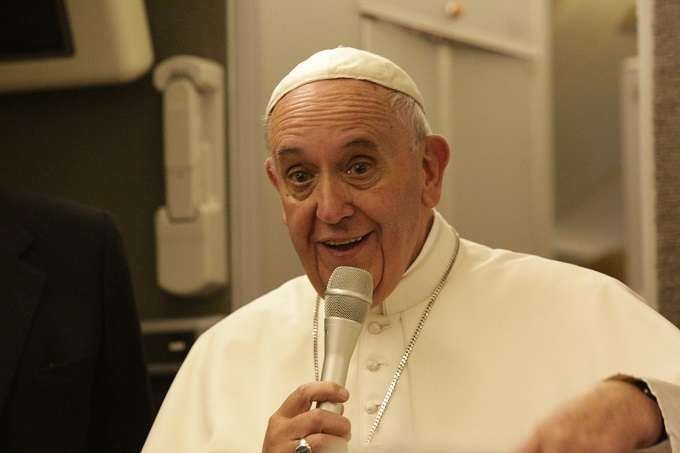 Pope Francis speaks to journalists aboard his flight from Philadelphia to Rome Sept. 27