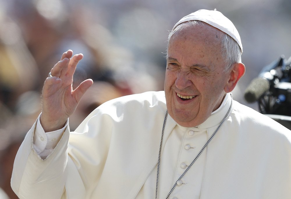 Pope Francis greets the crowd during his general audience in St. Peter's Square at the Vatican June 26