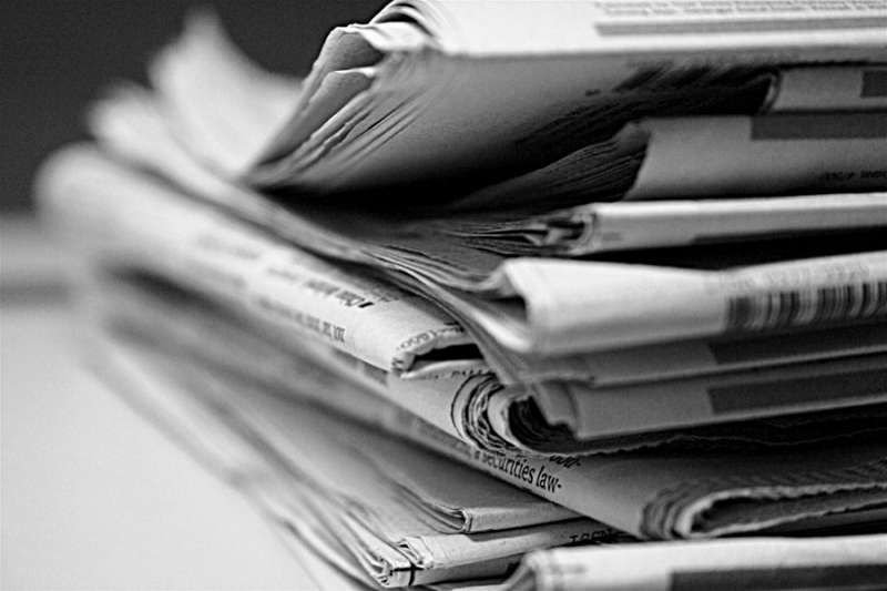 Stack of newspapers. Credit: Jason de Villa via Flickr (CC BY-NC 2.0) black and white added CNA.
