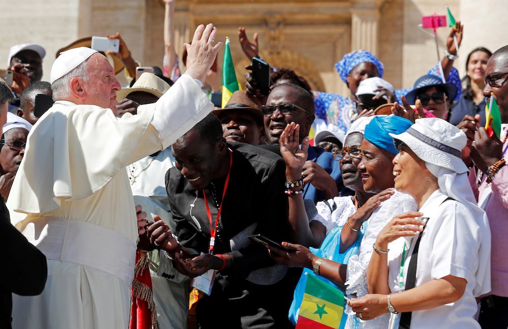 Pope Francis blesses pilgrims during his general audience in St. Peter's Square at the Vatican Sept. 11