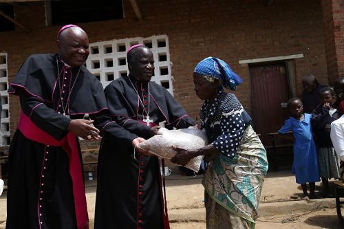Archbishop Thomas Msusa of Blantyre and Bishop Martin Mtumbuka of Karonga distribute food to flood victims in Malawi's Thyolo district