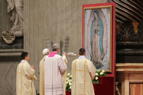 Pope Francis venerates an image of Our Lady of Guadalupe during a Mass in St. Peter's Basilica