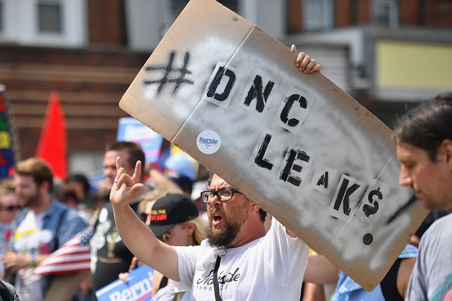 A protestor marches through downtown Philadelphia