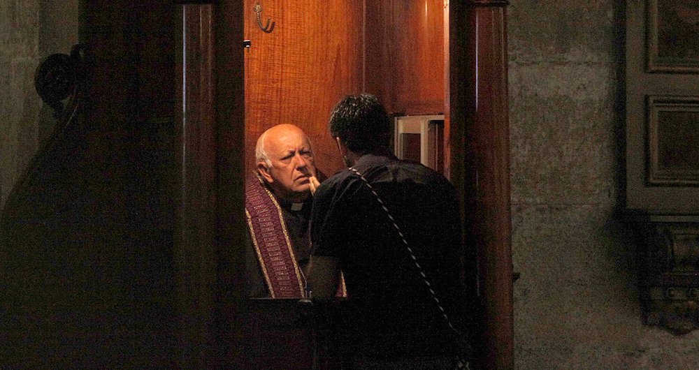 Chilean Cardinal Ricardo Ezzati hears confession at the Santiago cathedral Feb. 17