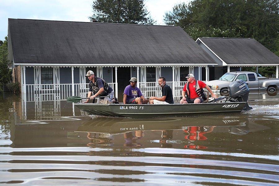 Record-breaking rains pelted Louisiana over the weekend leaving Baton Rouge with historic levels of flooding that have caused at least seven deaths. (Credit: Joe Raedle/Getty Images)