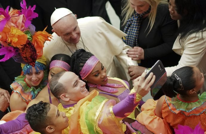 Pope Francis poses for selfie photos with members of the Circus of Cuba