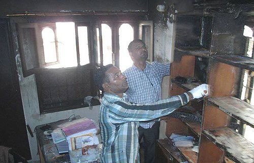 Locals examine the damage to the Capuchin friary in Karachi