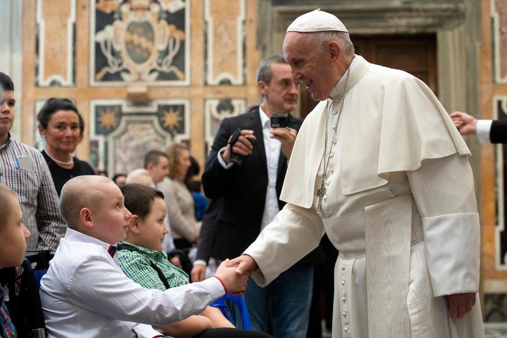 Pope Francis greets children receiving treatment at the Oncology Clinic of Wroclaw