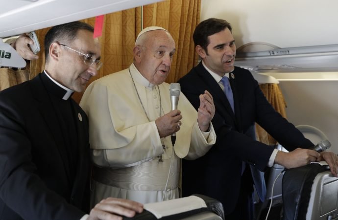 Pope Francis speaks to reporters during the flight from Rome to Rabat