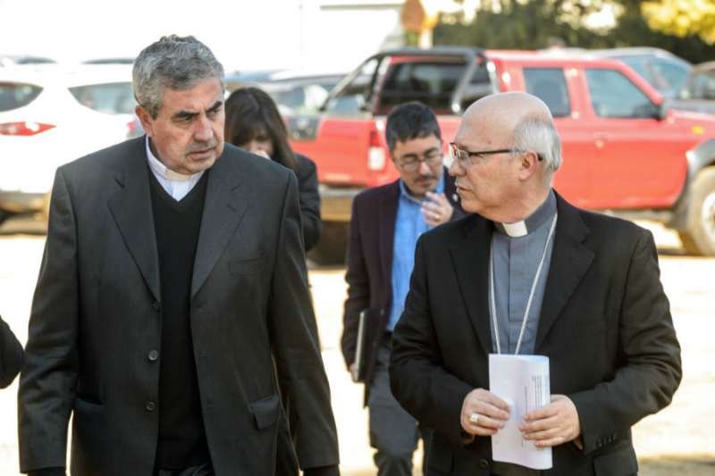 Bishop Santiago Silva of Chile's military diocese (L) and Bishop Fernando Ramos arrive for a bishops' assembly in Punta de Tralca