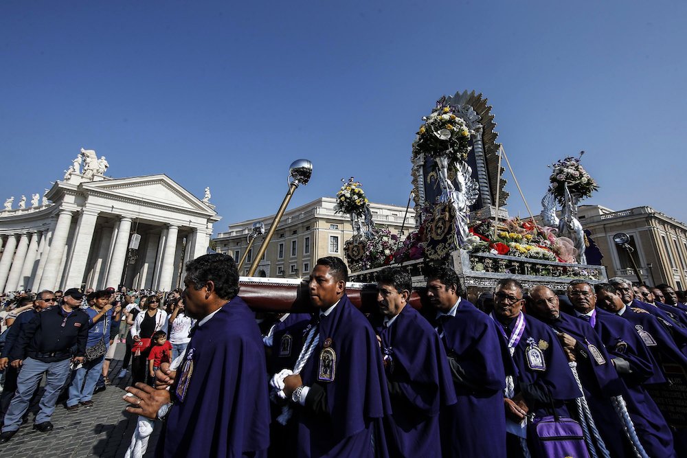 Peruvians arrive in St. Peter's Square Oct. 21 to take part in Pope Francis' Angelus at the Vatican. (CNS photo/Fabio Frustaci