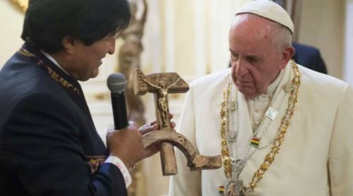 Bolivian president Evo Morales presents Pope Francis with a 'communist crucifix' at the presidential palace in La Paz