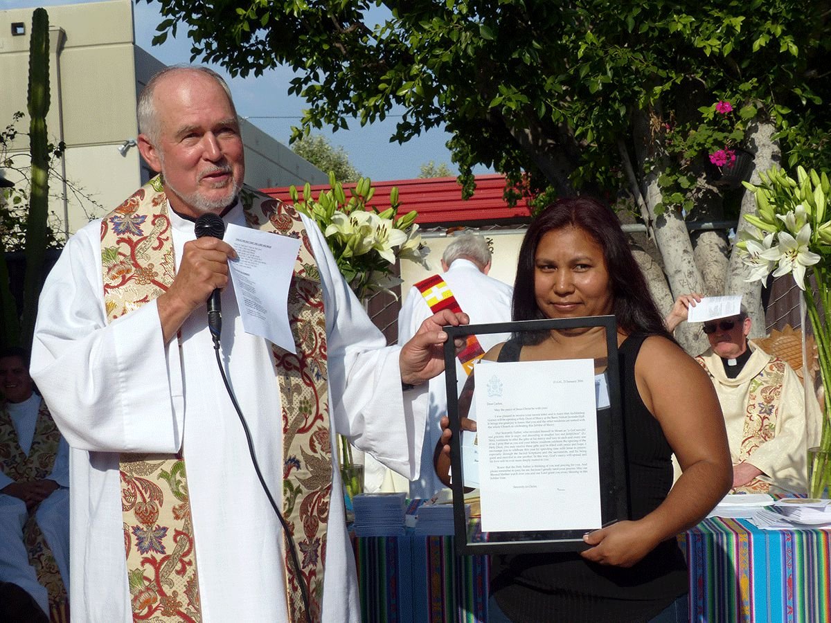 Father Mike Kennedy with Adriana Vasquez at his 50th jubilee as a Jesuit. (photo/ R.W.Dellinger)
