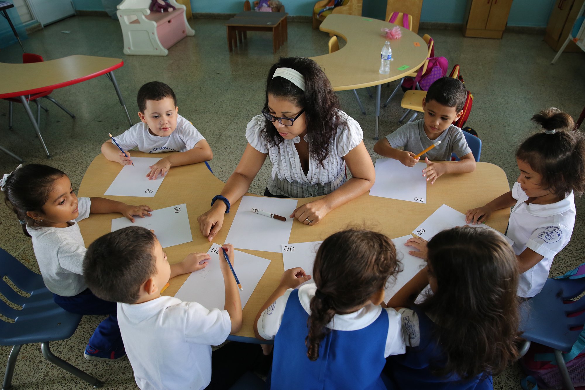 Maria Santiago works with her prekindergarten students at Good Heart of Mary Catholic School in San Juan in 2017.