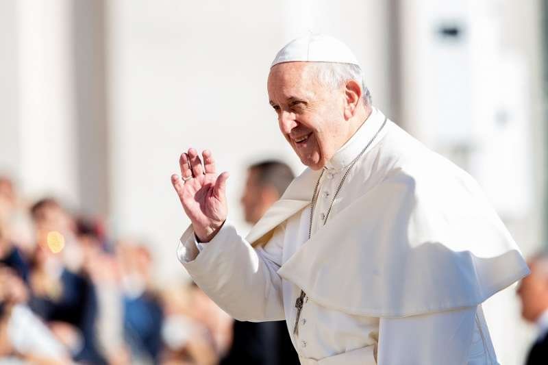 Pope Francis waves in St. Peter's Square Sept. 26