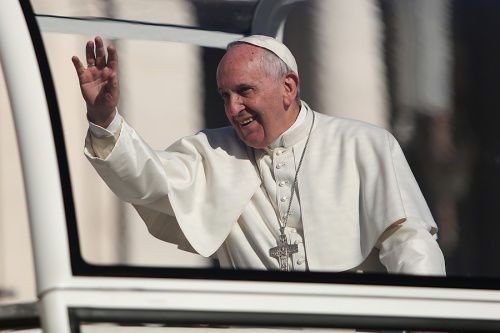 Pope Francis greets pilgrims inside St. Peter's Square during the Wednesday general audience on Feb. 11