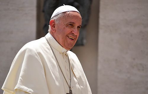 Pope Francis greets pilgrims in St. Peter's Square during his Wednesday general audience on June 18