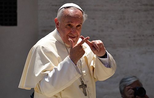 Pope Francis greets pilgrims in St. Peter's Square during the Wednesday General Audience