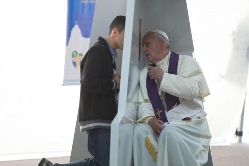 Pope Francis listens to confessions on July 26