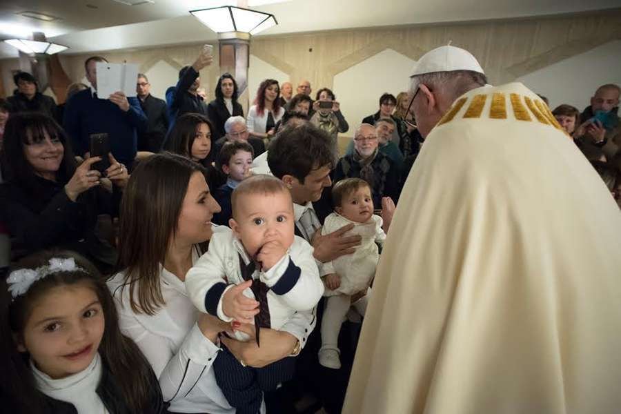 Pope Francis baptizes babies from earthquake zones in Italy at the chapel of Santa Marta. Credit: L'Osservatore Romano.