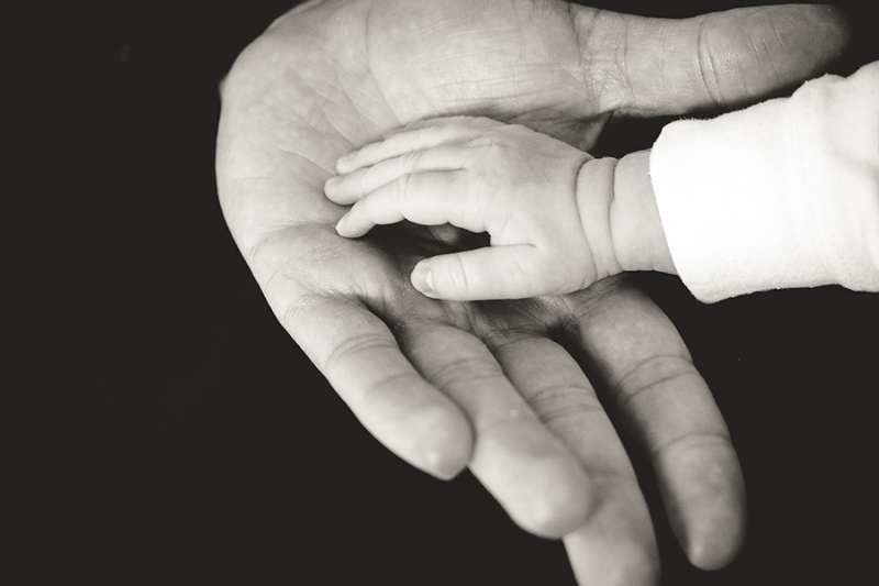 Dad and baby. Credit: Unsplash.