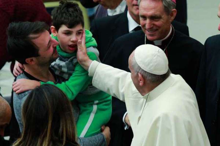 Pope Francis blesses the sick and disabled at the general audience at the Paul VI Hall in Vatican City on November 30