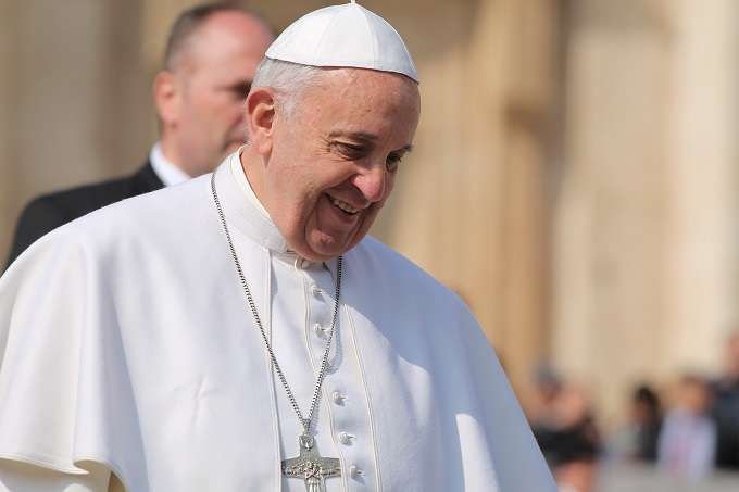 Pope Francis greets pilgrims during his March 11