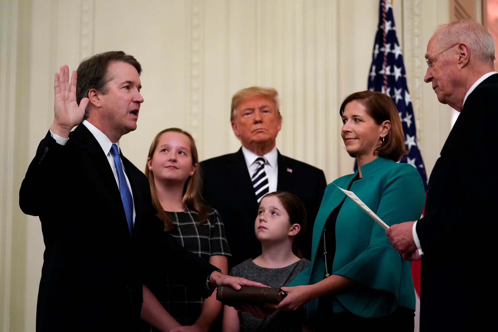 U.S. Supreme Court Justice Brett Kavanaugh places his hand on the Bible during his Oct. 8 public swearing-in ceremony with retired Justice Anthony Kennedy in the East Room of the White House in Washington. Also pictured are President Donald Trump and Kavanaugh's wife
