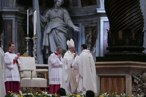 Pope Francis greets newly ordained priests during their Mass of ordination in St. Peter's Basilica