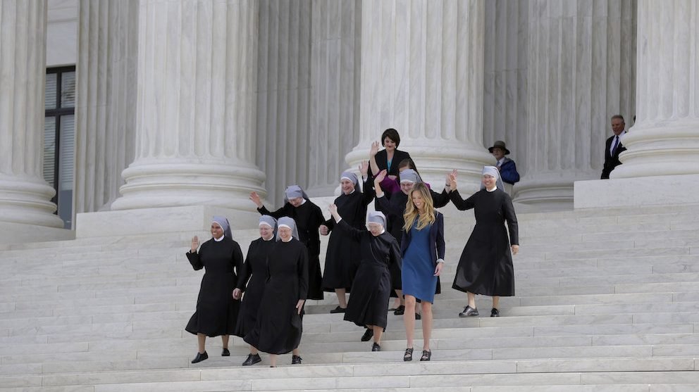 A group of Little Sisters of the Poor are joined by other women as they walk down the steps of the U.S. Supreme Court in Washington in 2016 after attending oral arguments in the Zubik v. Burwell contraceptive mandate case. (CNS photo/Joshua Roberts)