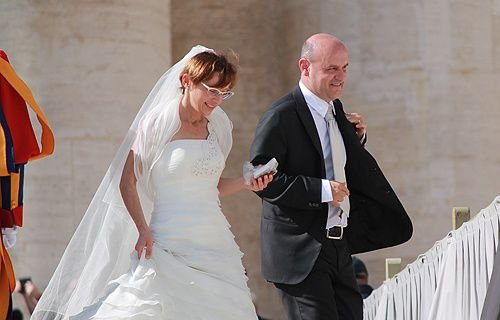 Couples at the Vatican wait to be blessed by Pope Francis on Oct. 16