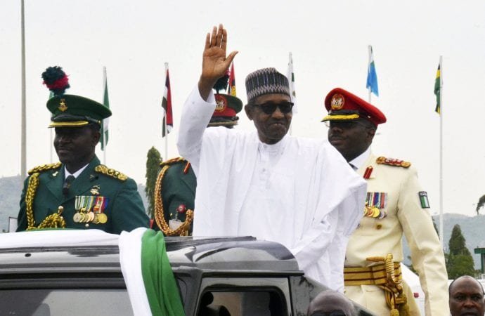 Nigerian President Muhammadu Buhari waves at the crowds before being sworn in for a second four-year term in Africa's most populous nation in Abuja