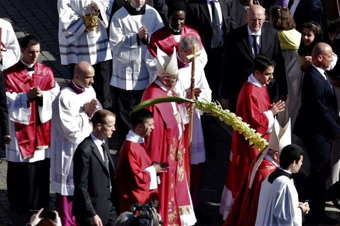 Pope Francis blesses palms during Palm Sunday Mass in St. Peter's Square April 9