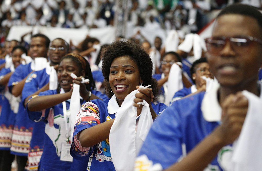 Young people cheer as Pope Francis leads an interreligious meeting with young people at the Maxaquene Pavilion in Maputo