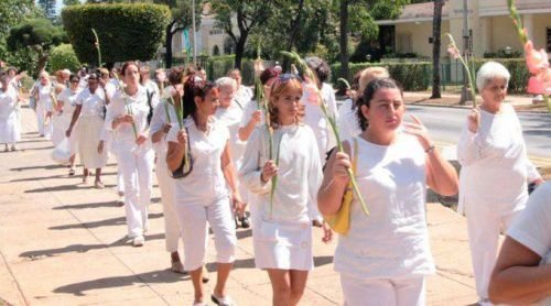 Women in White. Credit: Flickr via Dumplife Mihai Romanciuc (CC-BY-NC-2.0).