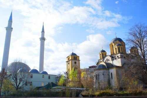 A church and a mosque adjacent one another in Ferizaj