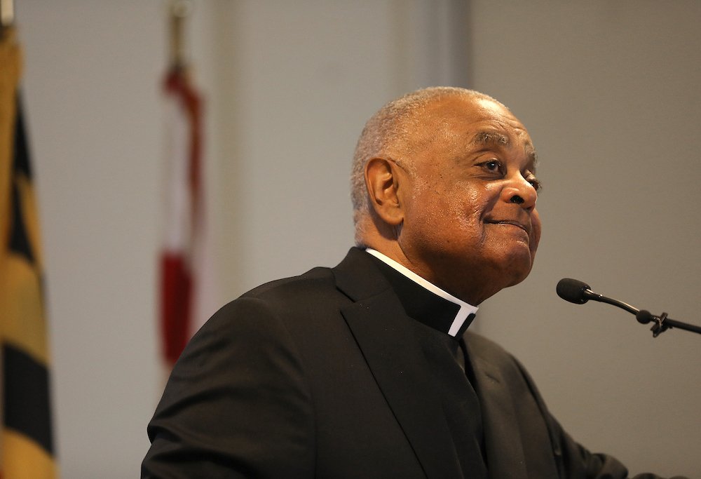 Archbishop Wilton D. Gregory listens to a question from a reporter during a news conference at the Archdiocese of Washington's pastoral center April 4