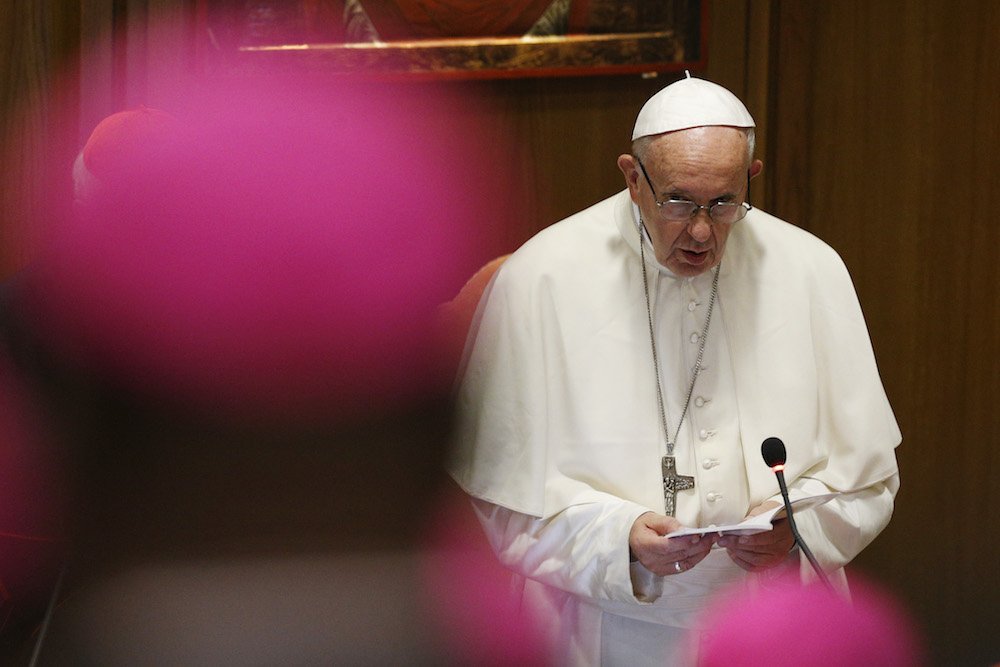 Pope Francis prays at the opening session of the Synod of Bishops on young people