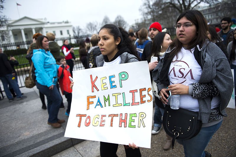 Immigration advocates demonstrate on Pennsylvania Avenue in front of the White House in Washington in this Dec. 30