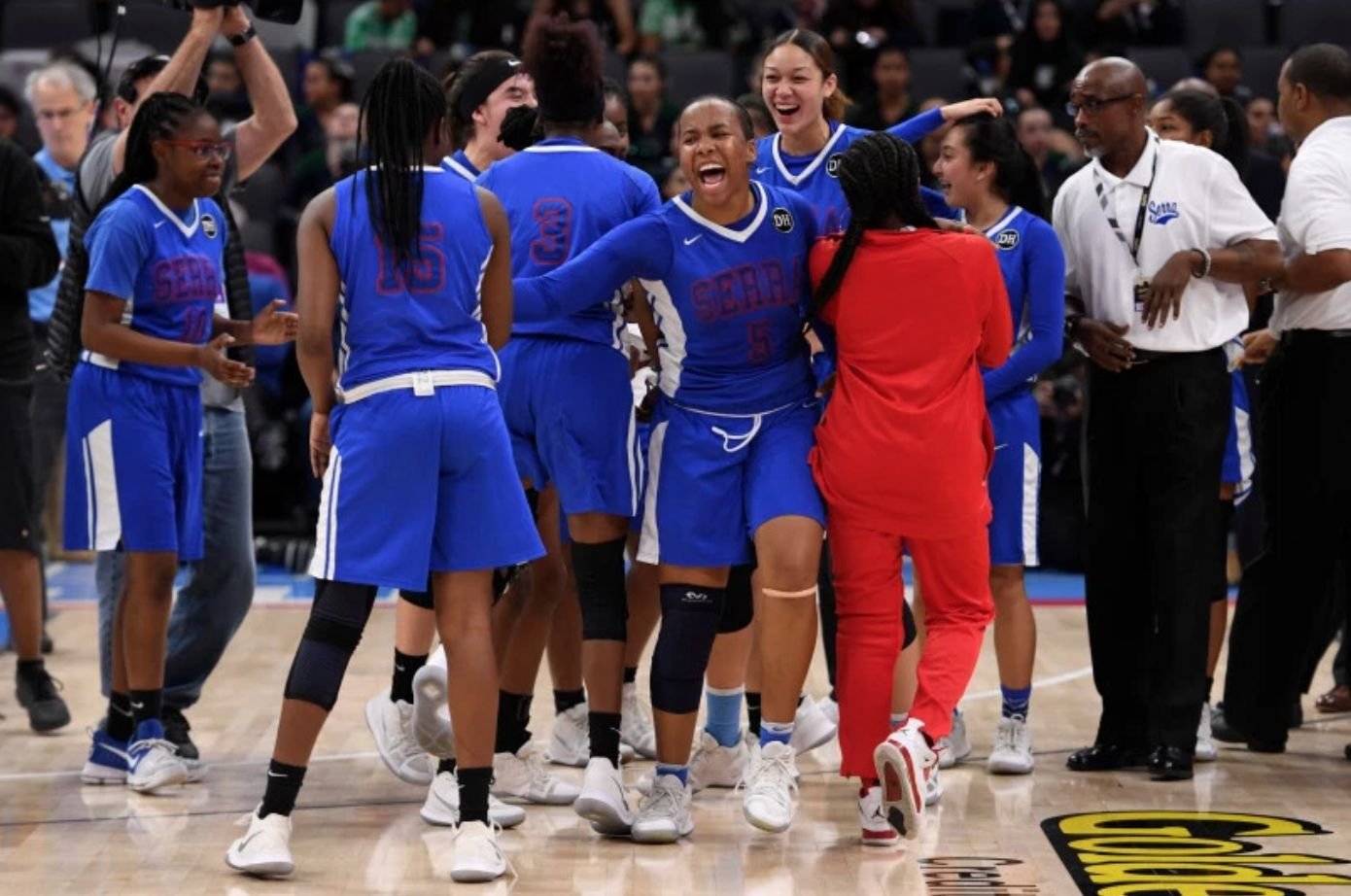 Serra's Lauryn Pointer (5) celebrates with their teammates after defeating Sacred Heart Cathedral during their CIF Division I girls state basketball championship at Golden 1 Center in Sacramento