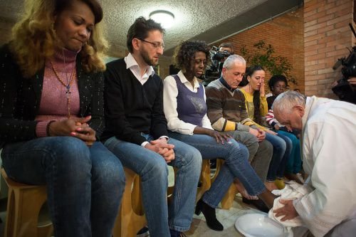 Pope Francis performing the rite of the washing of feet at a Holy Thursday Mass said at Rebibbia prison