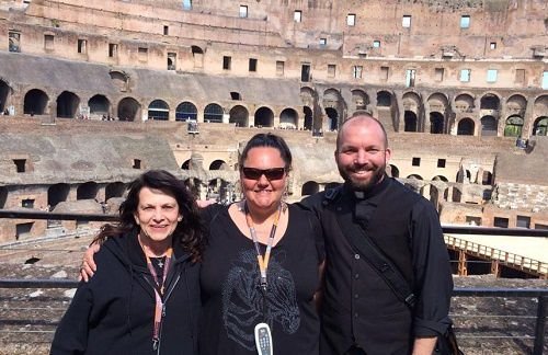 Clarissa "Glitterbear" Salazar (center) with Tanya Cangelosi and Fr. Michael O'Loughlin inside of the Colosseum in Rome Credit: Denver Homeless Ministries