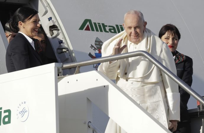 Pope Francis boards an airplane on his way to Panama