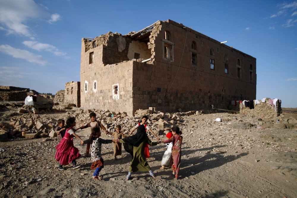 Children play Dec. 13 near a house destroyed in an airstrike allegedly carried out by the Saudi-led coalition in Sanaa