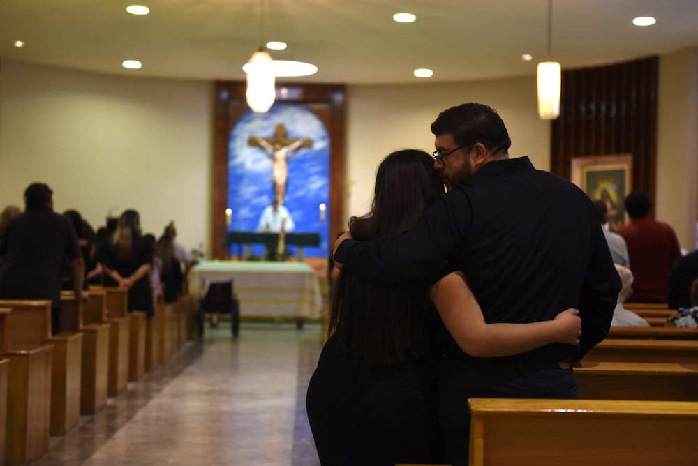 Friends and family attend the funeral Mass of Juan Velazquez at Our Lady of the Light Church in El Paso