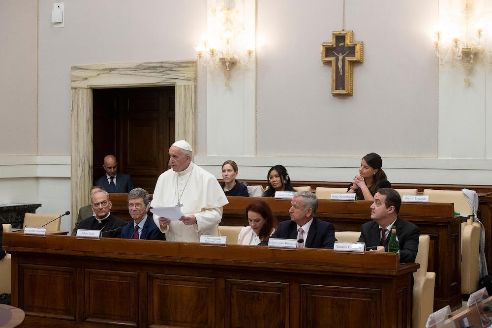 Pope Francis addresses participants of a Vatican climate change conference for finance ministers from around the world May 27